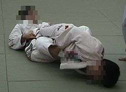 Judoka demonstrate Ashi-Hishigi/Achilles lock
