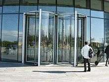 A video of a pair of revolving doors, one revolving clockwise, one revolving counterclockwise