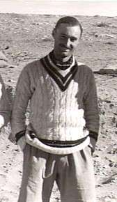 Informal portrait of man in cricket blazer with hands in pockets