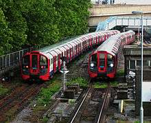Two Victoria line trains sitting in sidings
