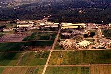 Aerial shot of campus buildings surrounded by agricultural land