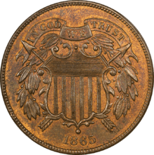 A bronze coin with a shield in the center, dated 1865.