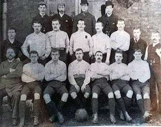 1891-92 Sheffield United F.C. first team.  Pictured (left to right) – Rear: Fred Davies, Harry Stones (assistant secretary), John Scott, Will Lilley Middle: W. Patterson, Rab Howell, Bob Cain, Charlie Howlett, Billy Hendry, Harry Lilley, W. Nesbitt, Fred Housley (trainer) Front: Charles Stokes (football committee chairman), Sandy Wallace, Samuel Dobson, Harry Hammond (footballer)