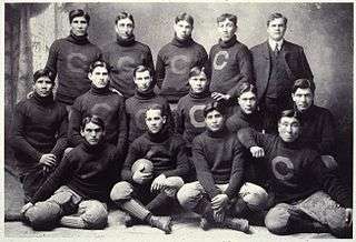 A football team picture, with men in sweaters