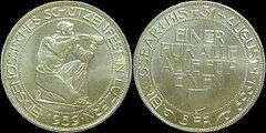 At left, the obverse of shooting thaler, showing a kneeling rifleman aiming to right, surrounded by the inscription EIDGENÖSSISCHES SCHÜTZENFEST IN LUZERN, with 1939 below. At right, the reverse, showing the words EINER FÜR ALLE, ALLE FÜR EINEN above the Lucerne coat of arms in the middle, with EINLÖSBAR BIS 31. AUGUST 1939 around the outer edge, and 5 FR at the bottom.