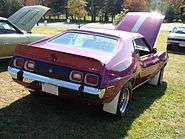 shows the rear end of a 1973 Javelin AMX finished in purple