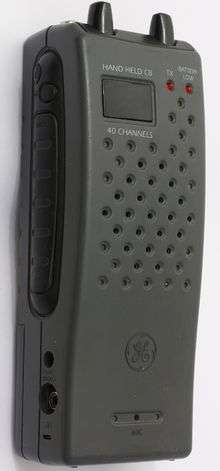 Close-up of gray walkie-talkie CB radio, viewed from the side