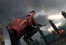 A scene from the film that accompanies the ride which features Harry Potter as portrayed by Daniel Radcliffe riding a broomstick.