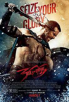 In this movie poster, a bare-chested Sullivan Stapleton in his role as Thermistocles is shown in the midst of battle, his face in combat rage. He carries a shield in his left hand, a bloodied short-sword in his right, and is stabbing downwards at an unseen enemy to the right. In the background floats the movie catch phrase: Seize Your Glory.