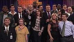The cast and special guests of the 30 Rock episode "Live Show" stand on the set of The Girlie Show with Tracy Jordan. From left to right: Tracy Morgan, Jack McBrayer, unidentified, Matt Damon, Rachel Dratch, Scott Adsit, Grizz Chapman, Tina Fey, Cheyenne Jackson, Alec Baldwin, Jane Krakowski, Jon Hamm, Kevin Brown, Julia Louis-Dreyfus, Chris Parnell, Bill Hader, and John Lutz