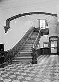 Entrance hall main stair with wood banister