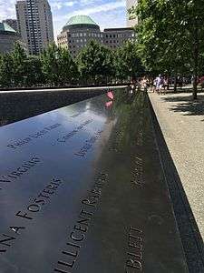 A black plaque with engravings of the names of people who died in the September 11 attacks