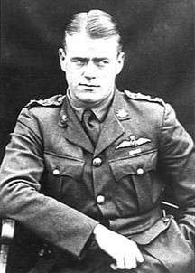 Half portrait of man in military uniform with pilot's wings on chest
