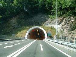 Road tunnel portal with variable traffic signs placed above the tunnel entrance
