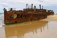 and the rusted remains of the ship in 2007