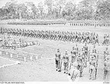 Soldiers marching around a parade ground