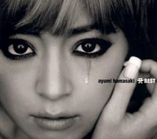 A dark, black-and-white up-close shot of Ayumi Hamasaki looking into the camera, with a teardrop trickling down one cheek.