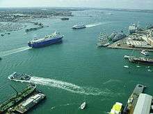 A view of various ferries, cargo and military vessels moving out of Portsmouth Harbour. This photograph was taken from the viewing deck of the Spinnaker Tower.