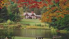 The Allegany State Park Administration Building as seen from the Red House Picnic Area across Red House Lake.
