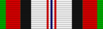 A multicolored military ribbon. From left to right the color pattern is; thin green stripe, thick red stripe, black stripe, very thick white stripe, thin red stripe, thin white stripe, thin black stripe, think white stripe, thin red stripe, very thick white stripe, black stripe, thick red stripe, think green stripe.