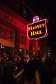 Exterior view of main entrance and neon signage of Massey Hall at night