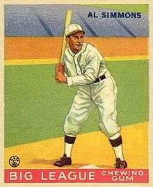 A baseball card picturing Al Simmons batting in a white uniform