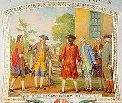 A painting shows men standing outside a yellow building; the men are dressed in revolutionary clothing with tri-pointed hats and powdered wigs.