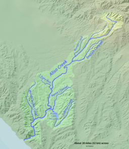 Aliso Creek drains a roughly spoon-shaped area (light brown). It is bordered by the cities of Laguna Beach, Aliso Viejo, Laguna Hills, Lake Forest, Foothill Ranch, Portola Hills, Mission Viejo, and Laguna Niguel, clockwise from bottom left. There are several forks of the creek including English Canyon Creek, the Dairy Fork, the Aliso Hills Channel, Sulphur Creek, and Wood Canyon Creek.