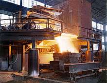 Molten steel pours from a furnace