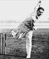 A cricketer pictured just after having bowled the ball