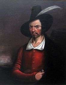 Painting of stern-faced man with Guy Fawkes' style black hat. His right hand holds the handle of a dagger tucked into a cloak hanging from his left shoulder.