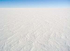 aerial view of ice sheet covered in snow Antartica