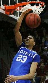 Anthony Davis dunks the ball while playing for Kentucky