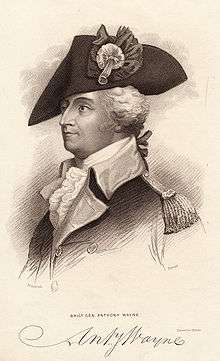Black and white print shows a man in a large tricorne hat with a large cockade. He wears a dark military coat with lighter lapels and a white ruffled shirt at his throat.