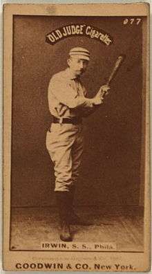 A baseball player with a bat in his hands, as if he is ready for a pitch to be delivered
