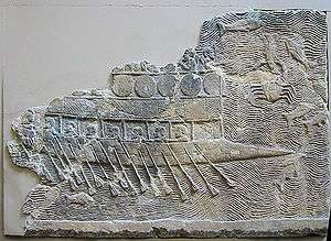 WA 124772: An Assyrian warship carved into stone (700–692 BC) from the reign of Sennacherib. Nineveh, South-West Palace, Room VII, Panel 11. British Museum.