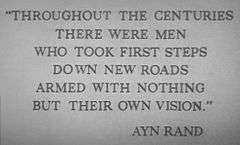 An engraving in all capital letters that reads: "Throughout the centuries there were men who took first steps down new roads armed with nothing but their own vision." Ayn Rand
