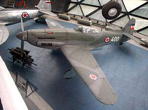 a colour photograph of an aircraft in Yugoslav markings in a museum
