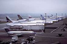 Larger planes lined up at a terminal