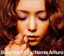 A close-up face shot of Namie Amuro, with the song and artist's name at the bottom centre of the image.
