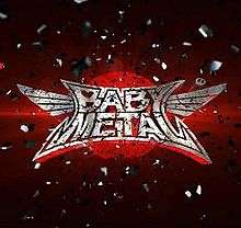 The Babymetal logo, set over a red circle on a darker red background, surrounded by an explosion of silver particles