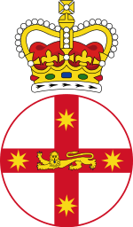 Crest featuring crown atop white disk with red cross, and lion in centre