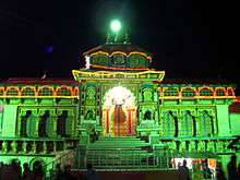 image of the temple at night illuminated with green light