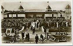 Bandstand with brass band and audience in 1925