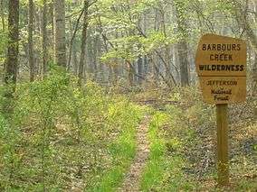 Photo of a sign at the entrance to Barbours Creek Wilderness along a hiking trail