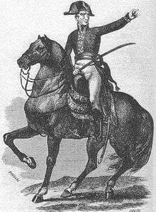Black-and-white print of a man on horseback holding a saber and pointing to the viewer's right. He wears a dark coat of early 1800s style, white breeches, black boots, and a bicorne hat worn side-to-side.