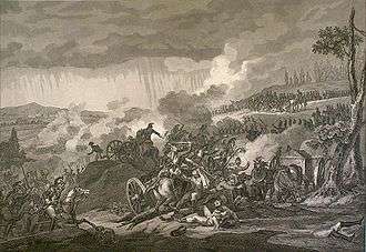 Dark clouds hang over a battle field. Trees have their tops blown off. Bodies of men and horses are scattered. A cannon lays overturned in the foreground.