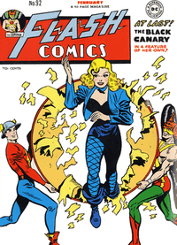 Blonde woman jumping through hoop held by two other superheroes