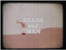 Title frame from film, with helicopter slinging a tranquilized bear
