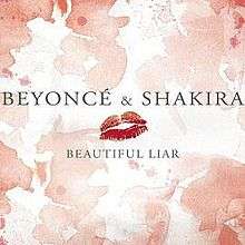 The words "Beyoncé & Shakira", a lipstick mark and the phrase "Beautiful Liar" are placed on a surface with red spots throughout.